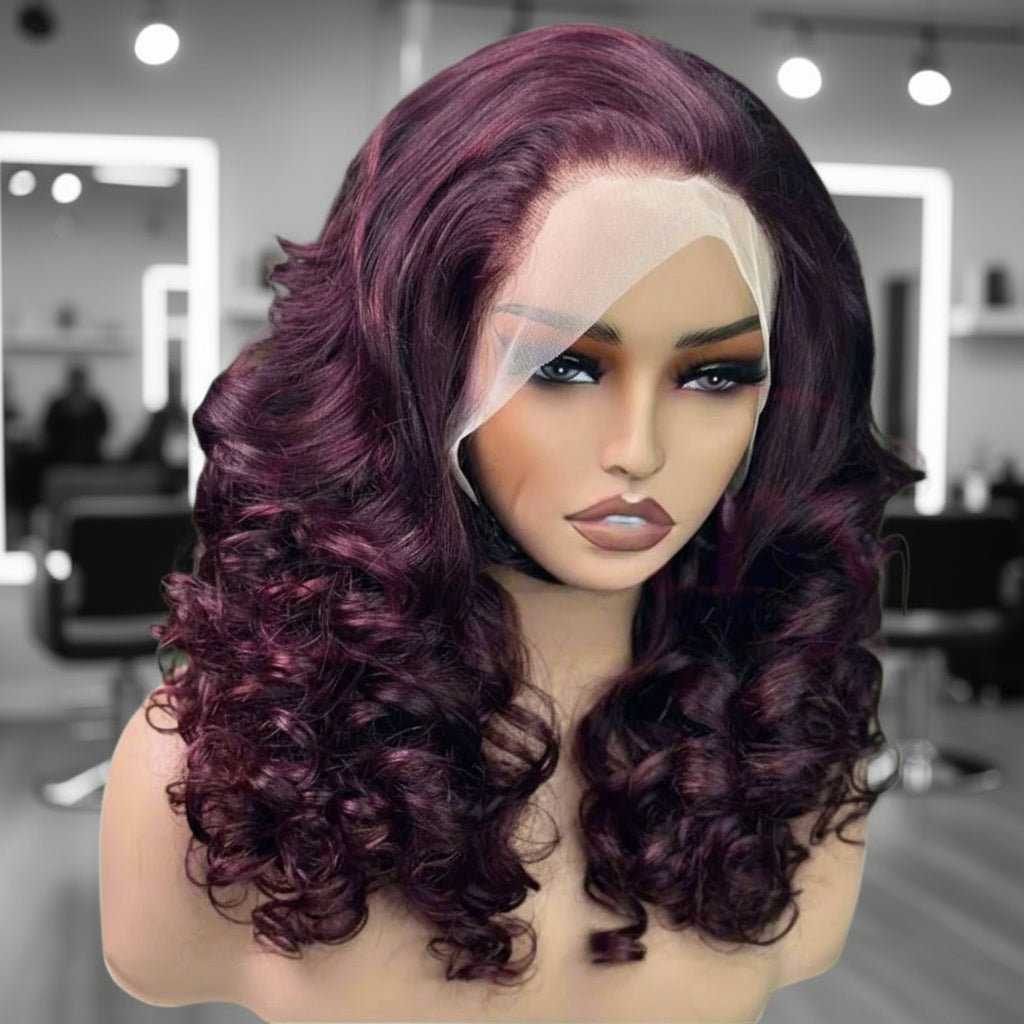 A mannequin head is wearing NuHaire's 99J Burgundy Full Density Bouncy Egg Curly Lace Front Human Hair Wig, showcasing a flawless burgundy hair color, premium human hair quality, transparent lace front, natural hairline, and bouncy egg curl texture.
