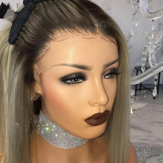 A mannequin head showcases NuHaire's ombre ash blonde 13x6 lace front European human hair wig, featuring a straight bob cut and highlighting the ombre coloring, natural hairline, and thin transparent lace up close.