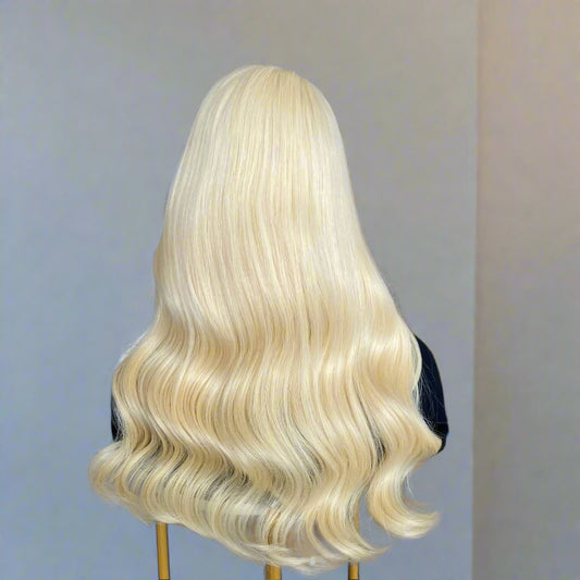 613 light Blonde European human hair 9x5 glueless wig on a mannequin head in NuHaire Hair Salon.