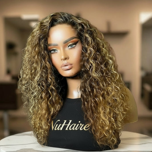 Honey blonde highlight curly wig from side angle showing dimensional highlights and bounce