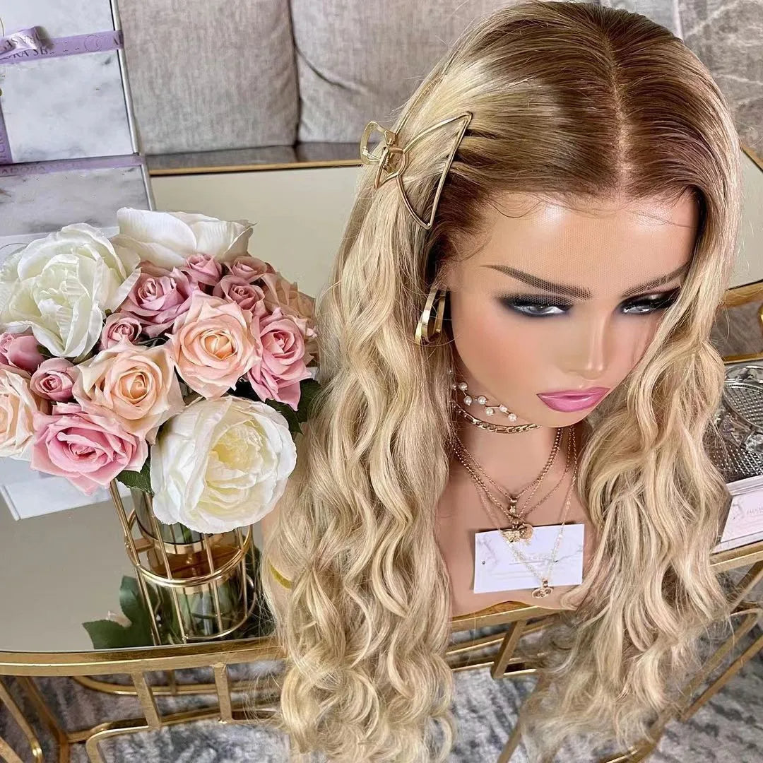 European human hair shadow root Blonde 13x4 lace front loose wave wig displayed on a mannequin head showcasing up close angle of texture, color, length, and natural density with a decorative backgroud