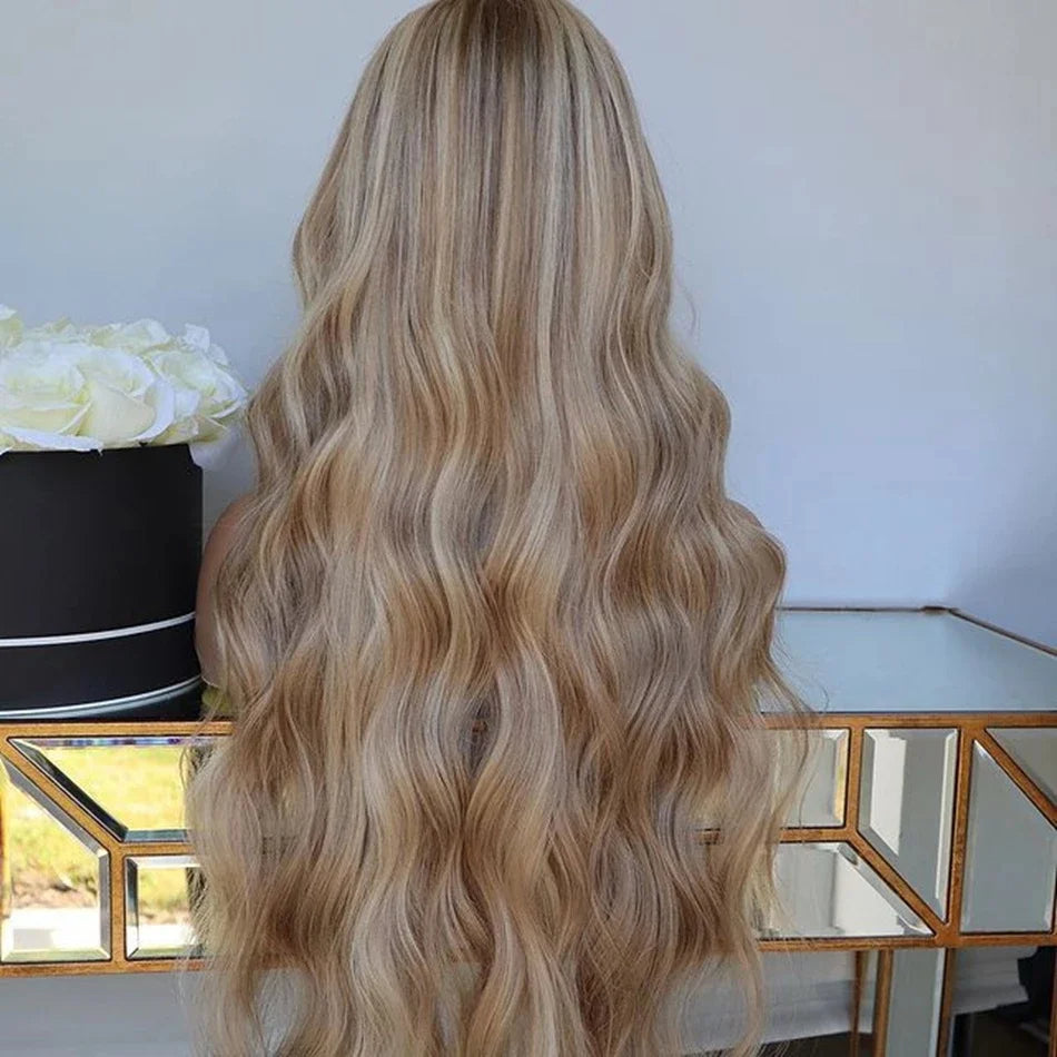 Mannequin displaying back view of 4/613 light blonde ombre 13x6 transparent lace front wig displaying loose beach wave texture, natural density, and full length European virgin hair with neutral background in different lighting