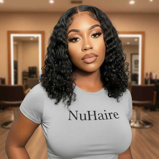Model displays NuHaire's Brazilian Water Wave Ultra Thin Invisible HD Lace Closure features a natural black color and premium human hair. Available in Brazilian and Indian textures with various lace sizes, it offers full volume and a flowing water wave texture.
