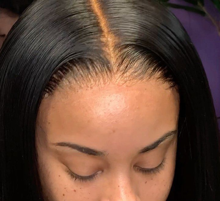 Close-up of a person wearing a wig installed using NuHaire Peach Scented Lace Melting Spray, showing skin melt