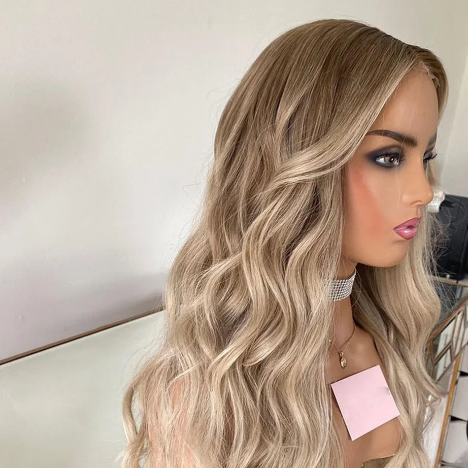 Side view of Mannequin displaying 4/613 light blonde ombre 13x6 transparent lace front wig displaying loose beach wave texture, natural hairline, and full length European virgin hair with neutral background
