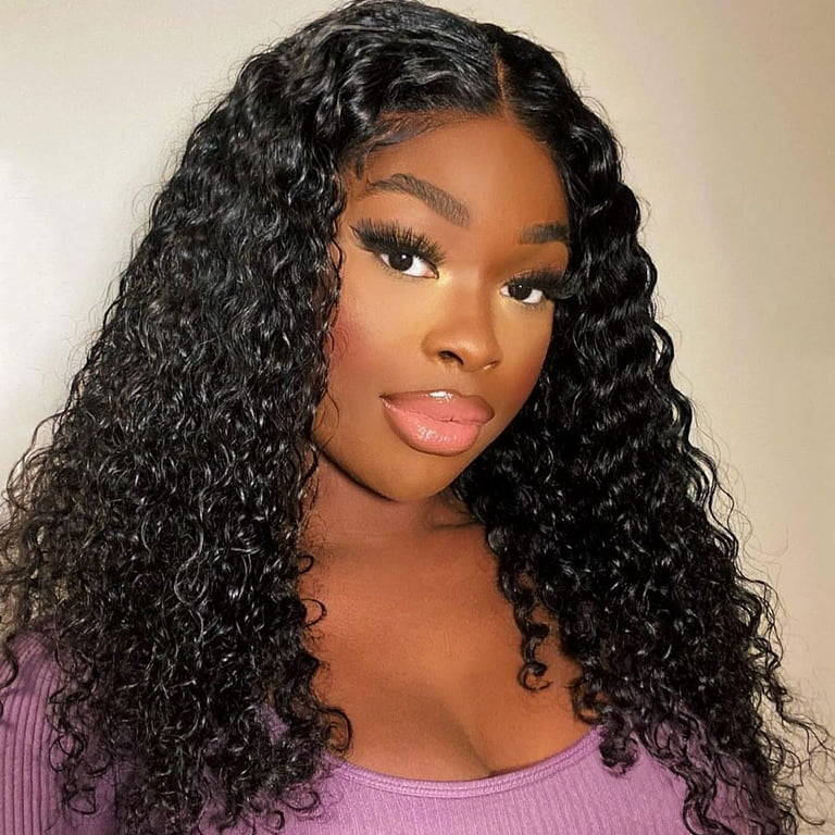 A woman is wearing an easy-to-install NuHaire Kinky Curly human hair wig with 180% density, providing full volume from root to tip.