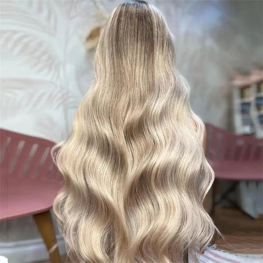 13x4 Light Ash Blonde Body Wave European Human Hair Wig back view displaying natural wavy texture, golden hair color, and natural movement