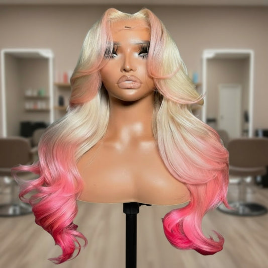 Mannequin head featuring NuHaire's 5x5 pink peekaboo highlights on a 613 blonde body wave human hair wig, showcasing a flawless color transformation, premium human hair quality, lace closure hairline, and bouncy body waves against a neutral background.