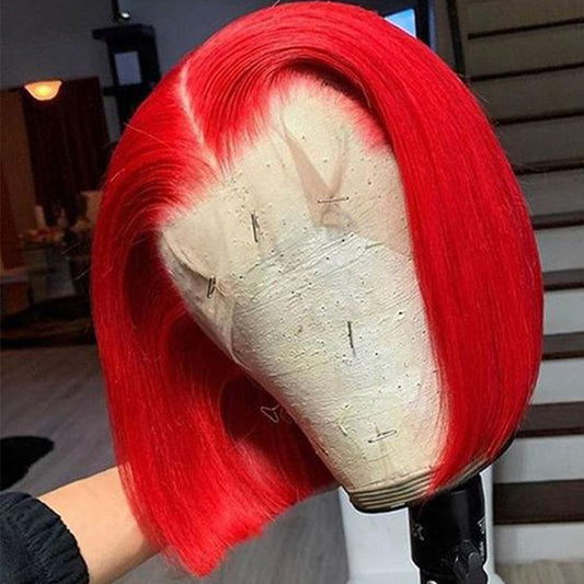 Red wig on a mannequin head with a blurred indoor background