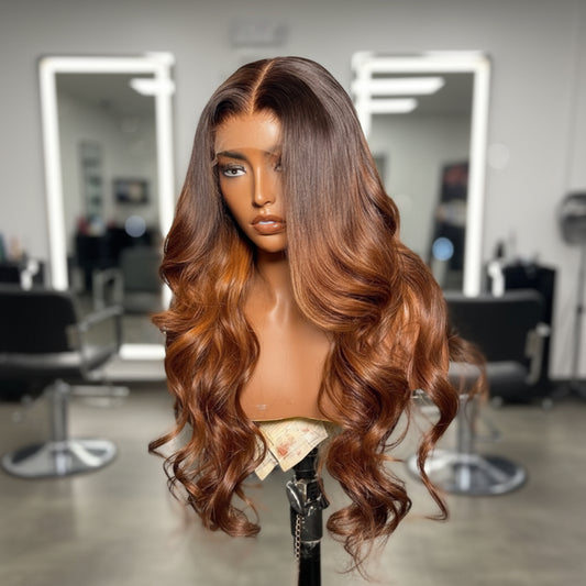 Mannequin head featuring a NuHaire Ombre Honey Brown Loose Wave 13x4 Lace Front Human Hair Wig, showcasing rich honey brown ombre, styling versatility, flowing wave texture, and skin melt thin 13x4 transparent lace.