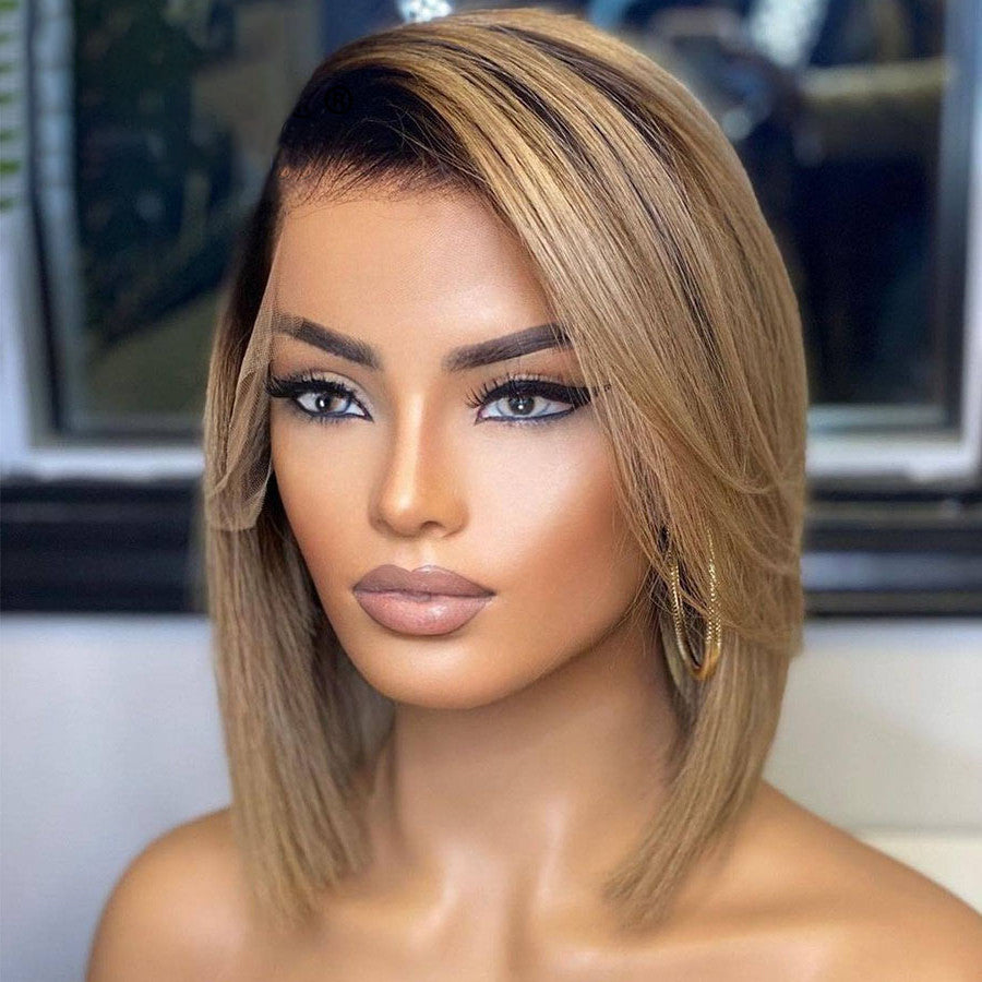 Side view of 13x4 Transparent lace front human hair Bob wig displayed on a mannequin head showing full volume, rich honey blonde ombre color, natural hairline, and straight texture