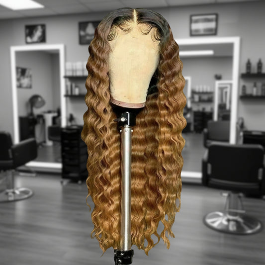 Front view of Mannequin head featuring a NuHaire Honey Blonde Ombre Deep Curly Human Hair Wig, showcasing rich honey blonde ombre, styling versatility, flowing deep curly wave texture, and skin melt thin 13x6 HD transparent lace.