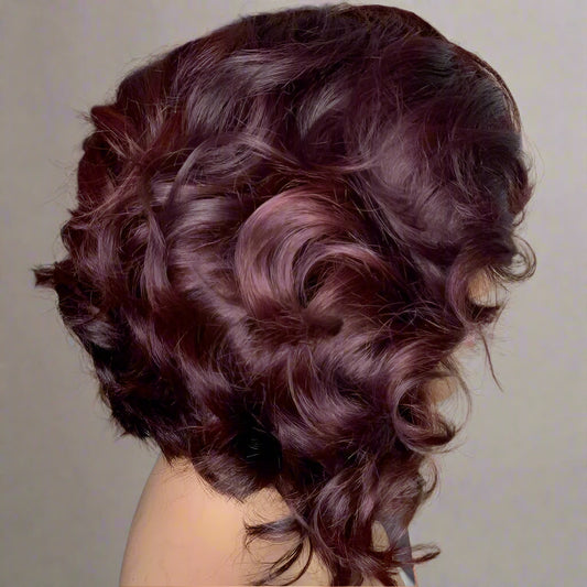 Side view of burgundy loose wave layered bob wig showing natural movement and layer definition