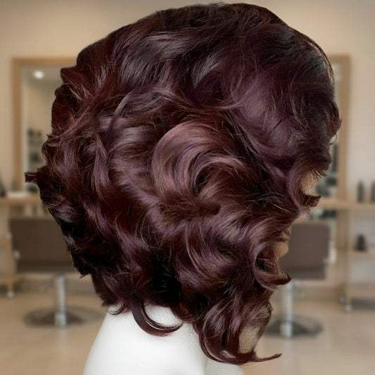 Side view of burgundy loose wave layered bob wig showing natural movement and layer definition