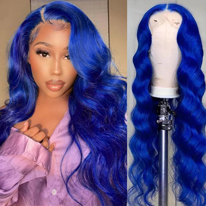 A vibrant blue body wave wig with soft, flowing curls that cascade elegantly. The hair features a natural shine and a layered cut, creating a lively and playful look. The wig is styled to frame the face beautifully, showcasing its rich blue color and texture.