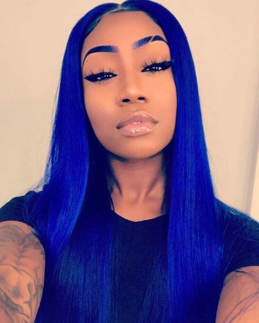 Woman wearing stunning royal blue straight wig with 13x4 lace front showing vibrant blue color and sleek straight texture