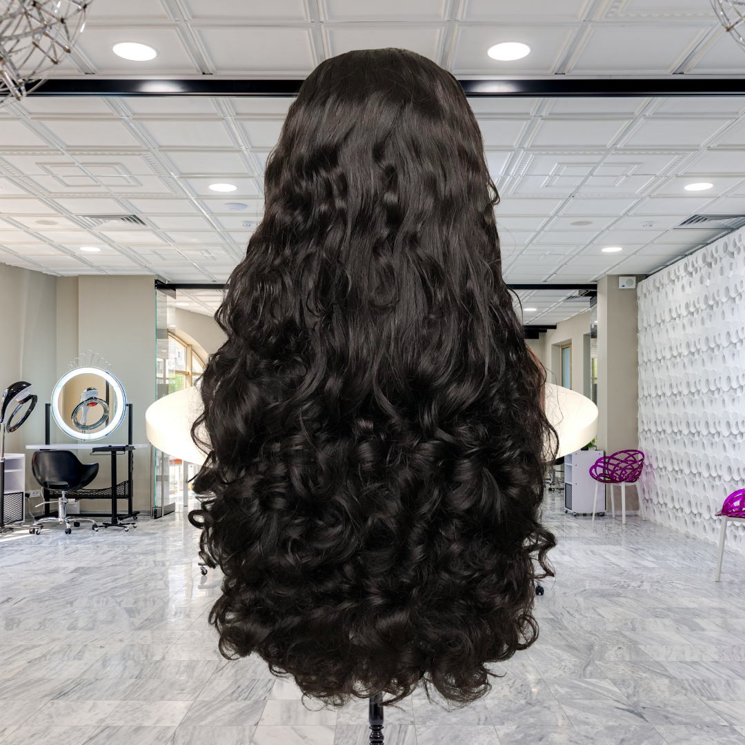Back view of 13x4 HD lace front Funmi Curl Indian human hair wig displayed on a mannequin head showing full volume, rich natural black color, and funmi curly texture