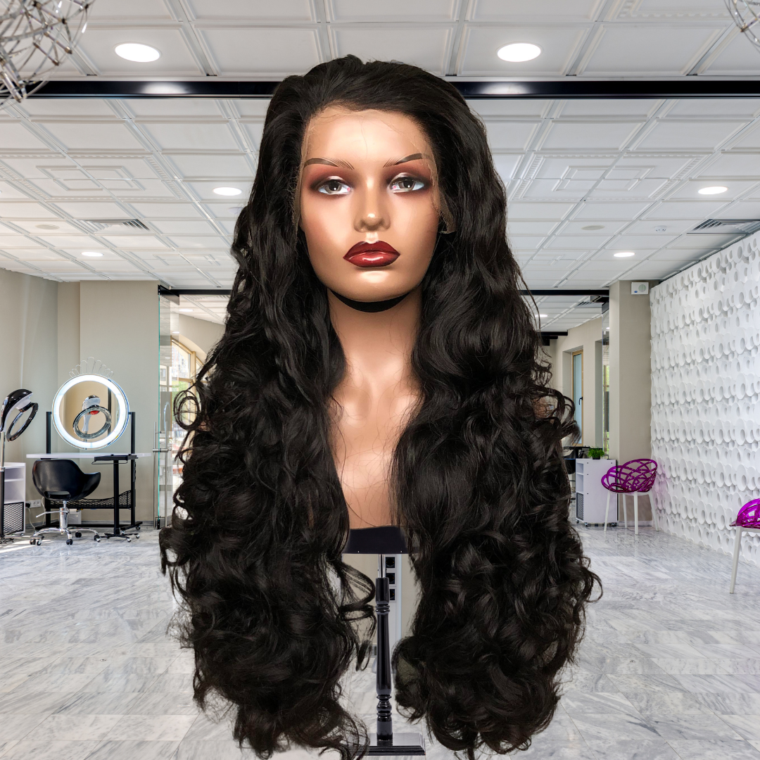 13x4 HD lace front Funmi Curl human hair wig displayed on a mannequin head showing full volume, rich natural black color, funmi curly texture, premium natural HD hairline, and realistic scalp