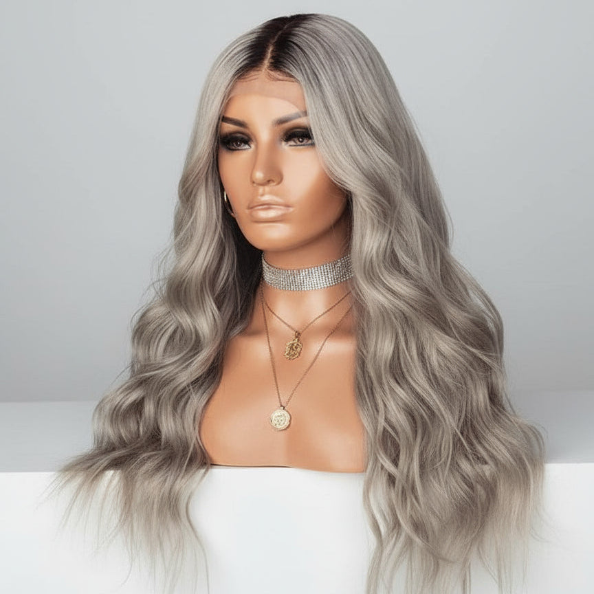 A mannequin displays NuHaire's Silver Blonde Ombre 13x4 Full Wavy Wig, featuring a dark root to silver blonde ombre color transformation. This high-quality human hair wig provides full 250% density volume and includes a 13x4 transparent lace for a natural hairline.