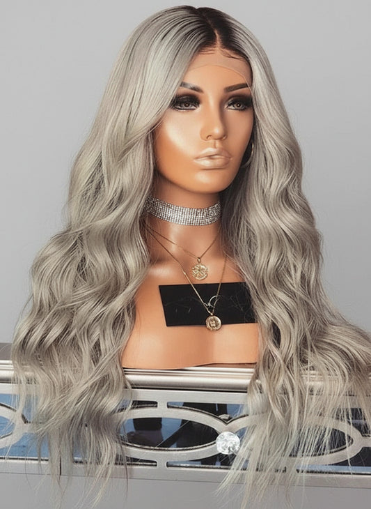 A mannequin displays NuHaire's Silver Blonde Ombre 13x4 Full Wavy Wig, featuring a dark root to silver blonde ombre color transformation. This high-quality human hair wig provides full 250% density volume and includes a 13x4 transparent lace for a natural hairline.