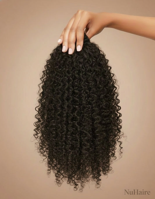 Hand is holding NuHaire's Kinky Straight | 1 Piece Human Hair Bundle features a natural black color and premium human hair quality. It is available in Brazilian and Indian hair textures, providing full volume from root to tip with natural kinky straight texture.