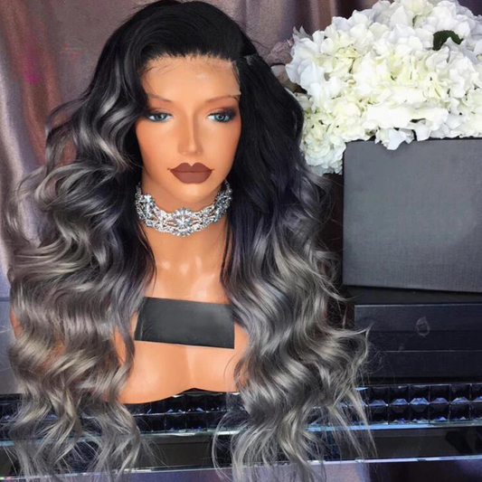 A mannequin head displaying NuHaire's High Density Grey Ombre Human Hair Wig, showcasing a flawless silver grey ombre color transition, premium human hair quality, 13x4 lace front, natural hairline, and flowing loose wave texture.