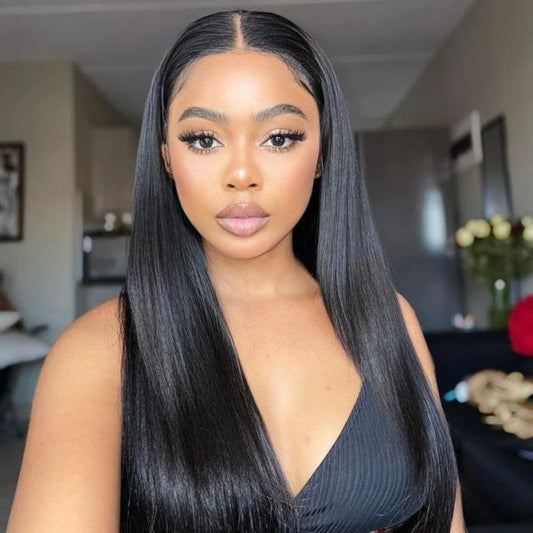 A model gracefully showcases NuHaire's 6x4 Silky Straight Wig, emphasizing its natural and seamless HD hairline, easy installation—ideal for beginners—premium quality human hair, and consistent fullness from root to tip.