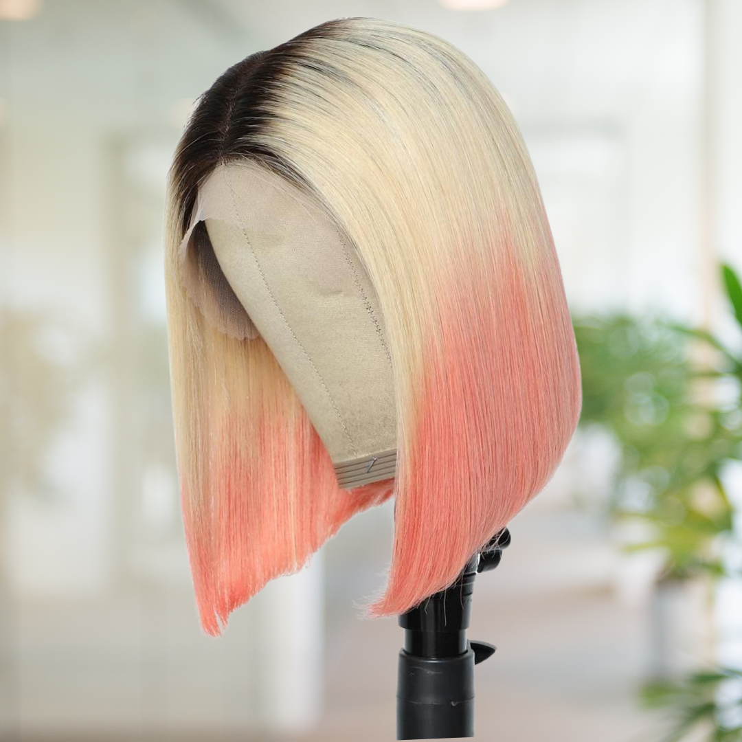 View of NuHaire human hair 13x4 lace front straight bob wig featuring a dark root, transitioning into light blonde, and ending with a pink ombre effect on mannequin head