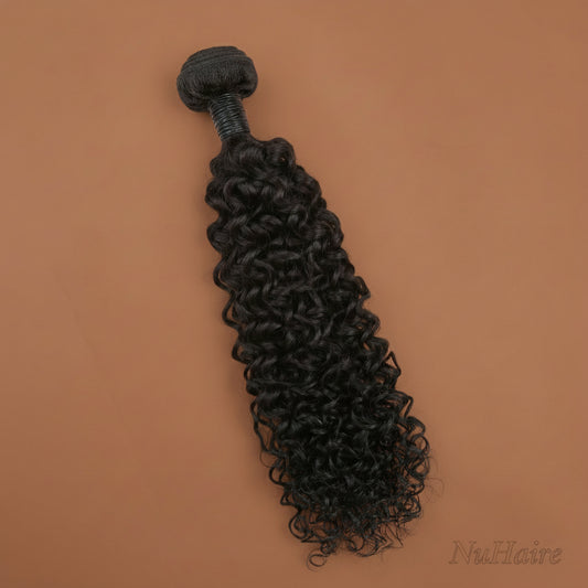 Product Display - NuHaire's Full & Thick Curly 1 pc Human Hair Bundle features a natural black color and premium human hair quality. It is available in Brazilian and Indian hair textures, providing full volume from root to tip with bouncy curly texture.