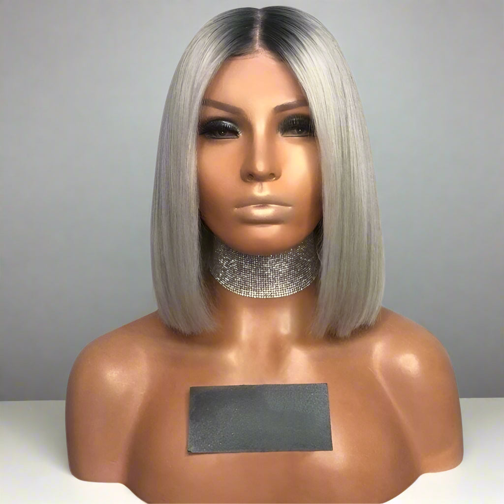 Front view of A NuHaire straight, short grey ash blonde wig with a 13x6 transparent lace front, showcasing a dark root shadow style, luxurious ash grey blonde coloring, premium European human hair, and a natural straight texture.