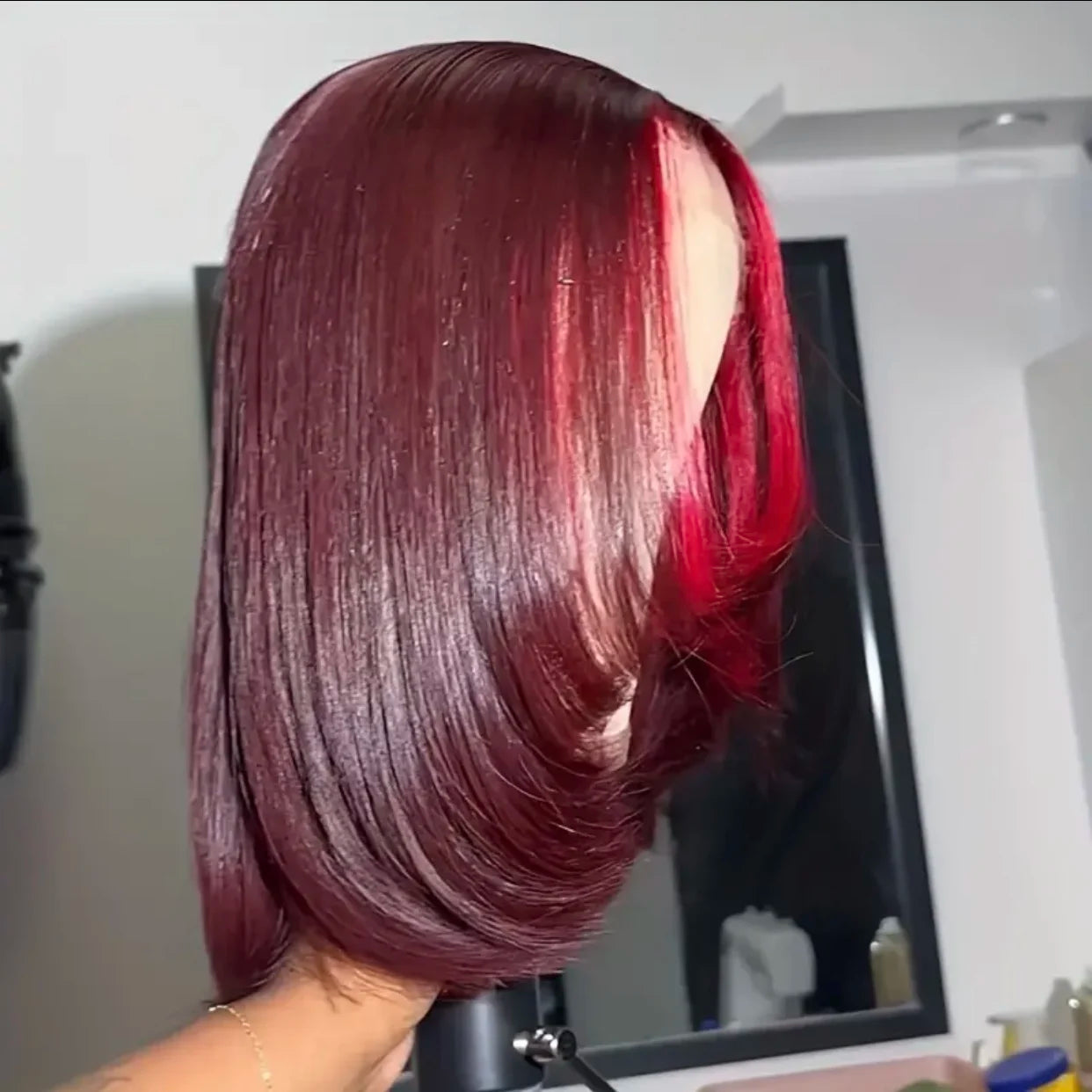 Side view of 13x4 Transparent lace front highlight human hair straight bob wig displayed on mannequin head showing chunky red highlight, rich 99J burgundy color, straight texture, premium natural hairline, styling versatility, and realistic scalp