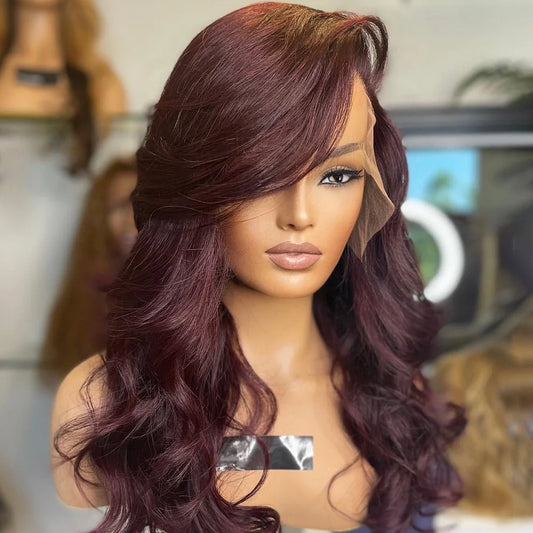 Deep Burgundy 13x6 Transparent lace front human hair natural wave wig displayed on a mannequin head showing a premium natural hairline, natural wave texture, and a realistic scalp in NuHaire hair salon