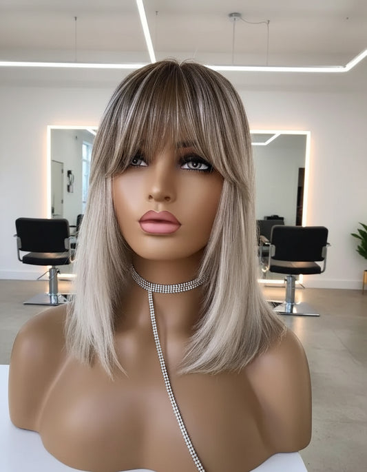 A mannequin showcases NuHaire's Short Straight Ash Blonde Highlight Bob Wig with Bangs, featuring high-quality European human hair, full volume, and easy installation for beginners.