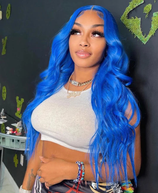 A person looking up wearing a NuHaire sky blue human hair wig with a 13x4 transparent lace front, pre-plucked hairline, and a white top.