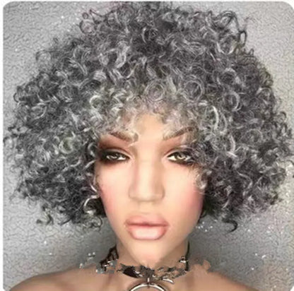 Front view of salt and pepper kinky curly bob wig on mannequin showing glueless construction and natural texture