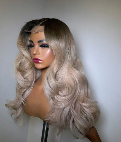 Wig display on Mannequin Head in different lighting to show the Ash grey blonde highlights, dimensional color depth and body wave pattern