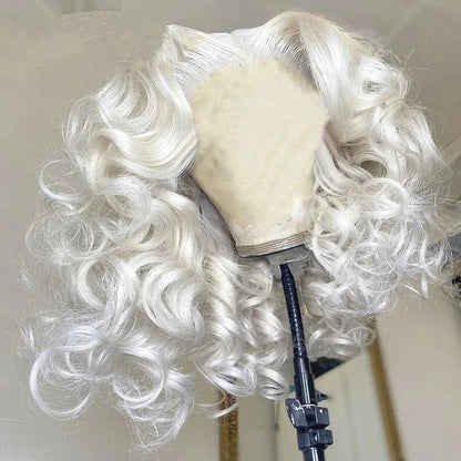 Platinum blonde loose curly wig from side angle showing natural movement and curly texture