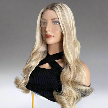 Side view of 18/60 pearl ash blonde natural wave wig showcasing luminous contrast and wave texture