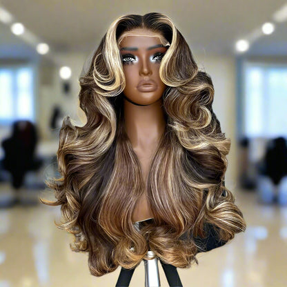 13x4 Transparent lace front human hair wig displayed on a mannequin head showing full 250% density volume, rich bronde highlight, natural hairline, long cascading waves, European human hair, and body wave texture in a hair salon