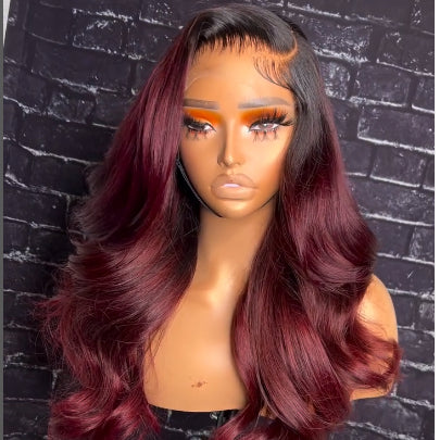 1B/99J burgundy ombre body wave wig with 13x4 transparent lace frontal on mannequin head from side angle displaying natural color gradient and lace construction