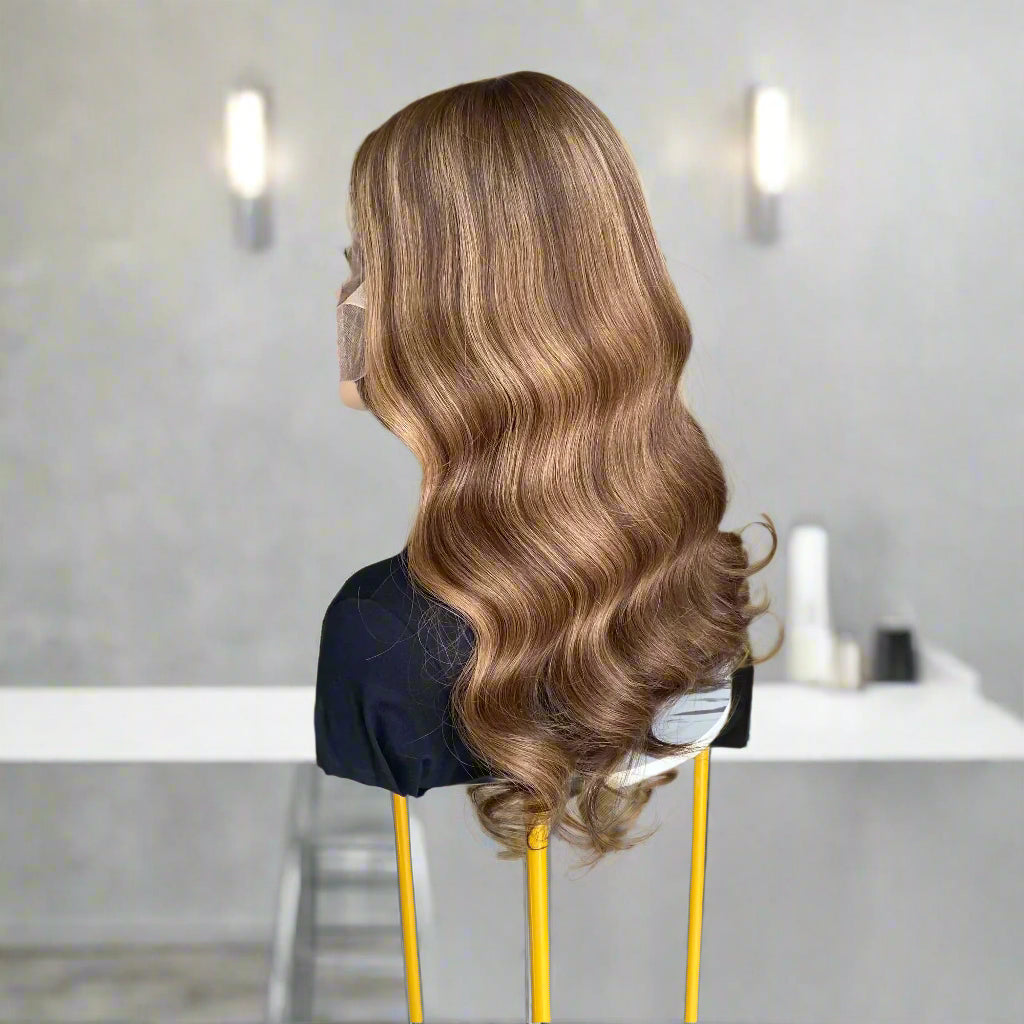 Side back view of Mannequin head with long, European human hair, featuring an Espresso Brown Balyage loose wavy 9x5 glueless mono lace wig, set on a table in hair salon