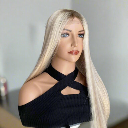 Platinum ash blonde wig styled with hair over shoulder showing natural drape and European hair quality