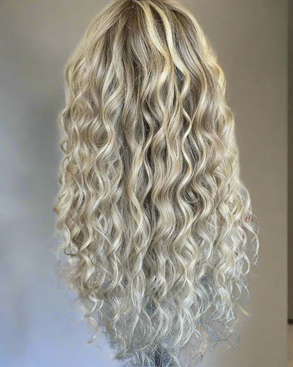 Back view of ash blonde highlight loose wave wig showing full hair density and natural wave pattern
