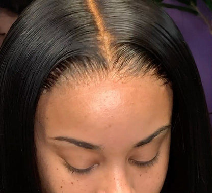 Close-up of a person wearing a wig installed using NuHaire Peach Scented Lace Melting Spray, showing  skin melt
