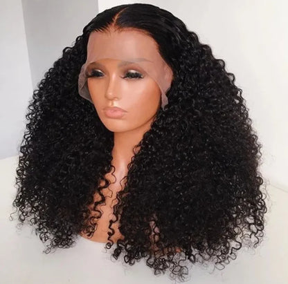 A mannequin head wearing NuHaire's kinky curly 13x6 lace front wig with a pre-plucked, pre-bleached hairline. The wig features a natural black color, full volume from root to tip, and skin-melt HD lace.