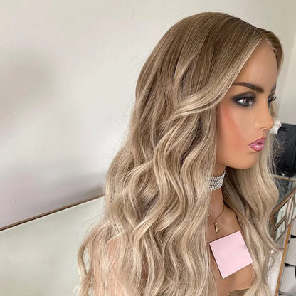 Side view of Mannequin displaying 4/613 light blonde ombre 13x6 transparent lace front wig displaying loose beach wave texture, natural hairline, and full length European virgin hair with neutral background