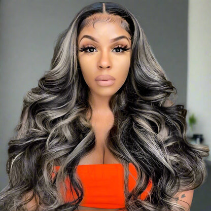 (Model looking forward wearing product): Front view of model in silver grey body wave wig showcasing natural hairline and sophisticated highlights