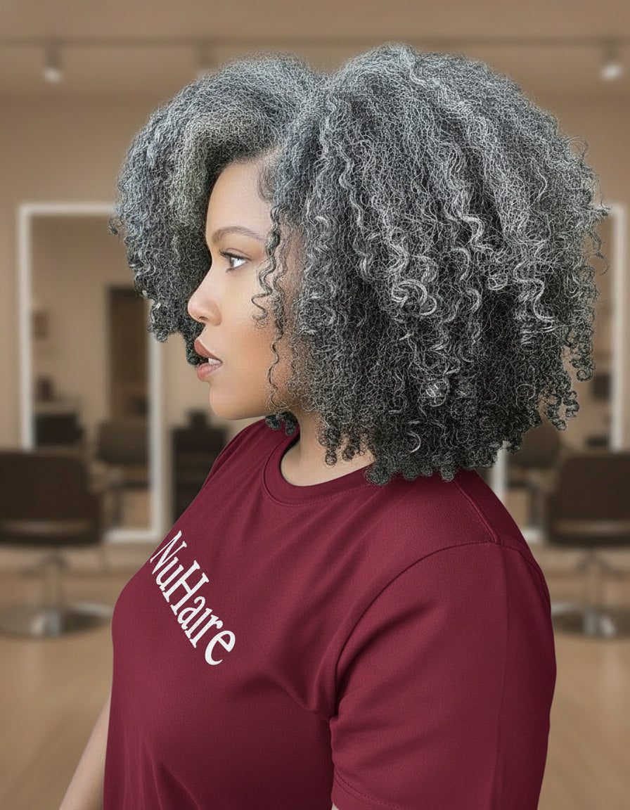 Side view of a Model showcasing NuHaire's Salt & Pepper Kinky Curly Bob | 13x4x1 Transparent Lace Human Hair Wig, featuring a natural black and silver grey hair color, premium human hair, bouncy kinky curly texture, and a 13x4 Transparent Lace Front.