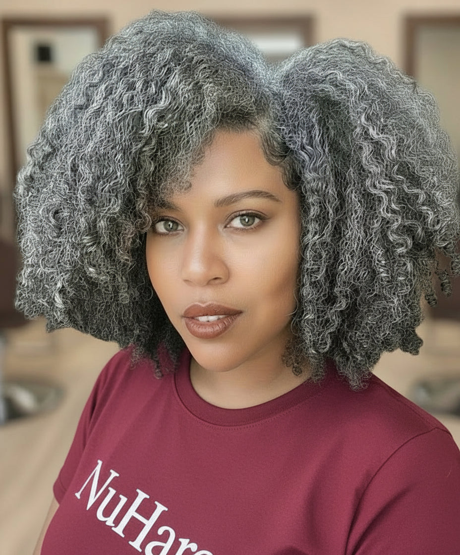 Closer view of a Model showcasing NuHaire's Salt & Pepper Kinky Curly Bob | 13x4x1 Transparent Lace Human Hair Wig, featuring a natural black and silver grey hair color, premium human hair, bouncy kinky curly texture, and a 13x4 Transparent Lace Front.