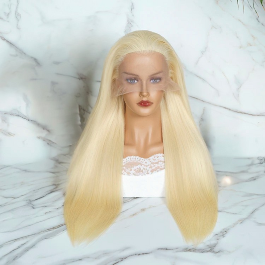 Mannequin head with long straight white blonde European human hair on a marble background